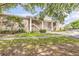 Well-maintained two-story condo building with brick accents, manicured landscaping, and convenient stairwell access to upper units at 160 Reserve Cir # 204, Oviedo, FL 32765