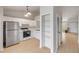 Bright kitchen with modern appliances, white cabinetry, and functional storage at 160 Reserve Cir # 204, Oviedo, FL 32765