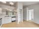 Bright, updated kitchen with white cabinets and modern appliances, adjacent to the dining area at 160 Reserve Cir # 204, Oviedo, FL 32765