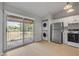 Well-lit kitchen featuring modern appliances, stacked washer/dryer, and sliding door to outdoor view at 160 Reserve Cir # 204, Oviedo, FL 32765