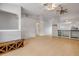 Open-concept living room with vaulted ceilings, breakfast bar, and modern wood floors at 160 Reserve Cir # 204, Oviedo, FL 32765