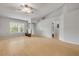 Spacious living room with vaulted ceilings, ample natural light, and sleek wood floors at 160 Reserve Cir # 204, Oviedo, FL 32765