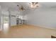 Bright open-concept living area flows into the kitchen, featuring wood floors at 160 Reserve Cir # 204, Oviedo, FL 32765