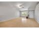 Bright living room featuring high ceilings, a large window, and light wood floors at 160 Reserve Cir # 204, Oviedo, FL 32765
