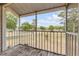Comfortable covered outdoor patio with wood floors and expansive views of the neighborhood landscape at 160 Reserve Cir # 204, Oviedo, FL 32765