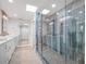 Elegant bathroom showcasing a modern glass shower, stylish tile, and dual vanity at 1601 S Riverside Dr, Edgewater, FL 32132