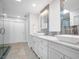 Sleek bathroom featuring a glass shower, dual sinks, and contemporary finishes at 1601 S Riverside Dr, Edgewater, FL 32132