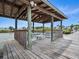 A covered dock with seating, offers a relaxing waterfront view and tranquil atmosphere at 1601 S Riverside Dr, Edgewater, FL 32132