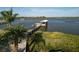 Waterfront property featuring a private dock, boat lift, and covered area for relaxing and enjoying the serene water views at 1601 S Riverside Dr, Edgewater, FL 32132