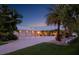 Spacious home featuring a large driveway leading to a three-car garage and beautiful landscaping at 1601 S Riverside Dr, Edgewater, FL 32132