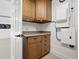 Functional garage with wooden cabinetry, pegboard, and plenty of room for storage at 1601 S Riverside Dr, Edgewater, FL 32132