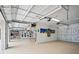 Spacious three-car garage with high ceilings, ample lighting, and plenty of room for parking and storage at 1601 S Riverside Dr, Edgewater, FL 32132