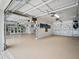 Spacious garage features painted floors, ample storage, and lots of room for parking and other activities at 1601 S Riverside Dr, Edgewater, FL 32132