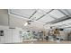 A large and well-lit garage with finished ceilings, and space for parking and storage at 1601 S Riverside Dr, Edgewater, FL 32132