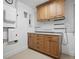 Functional garage with wooden cabinetry, pegboard, and plenty of room for storage and projects at 1601 S Riverside Dr, Edgewater, FL 32132