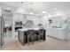 Bright kitchen featuring an island with breakfast bar, stainless steel appliances, and white cabinetry at 1601 S Riverside Dr, Edgewater, FL 32132