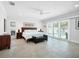 Serene main bedroom with a view of the pool, featuring tile floors and ample natural light at 1601 S Riverside Dr, Edgewater, FL 32132