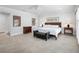 Large main bedroom with wood furniture, tiled floor, and access to ensuite and walk-in closet at 1601 S Riverside Dr, Edgewater, FL 32132