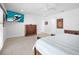 Spacious main bedroom with modern furnishings, a large TV, and ample natural light at 1601 S Riverside Dr, Edgewater, FL 32132