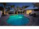 Private backyard pool with covered patio and waterfront views perfect for relaxing and entertaining at 1601 S Riverside Dr, Edgewater, FL 32132