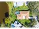 Aerial view of the property and backyard pool surrounded by a lush green lawn at 1688 Town Park Dr, Port Orange, FL 32129