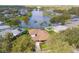 Aerial view of the property, neighborhood and lake in the backyard at 1688 Town Park Dr, Port Orange, FL 32129