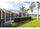 View of the enclosed pool and lake in the backyard provides the best of outdoor living at 1688 Town Park Dr, Port Orange, FL 32129
