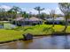 Aerial view of the backyard, pool, lake and mature landscaping at 1688 Town Park Dr, Port Orange, FL 32129