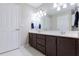 Spacious bathroom featuring a double sink vanity, ample storage, and clean, neutral finishes at 1688 Town Park Dr, Port Orange, FL 32129