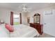Bright bedroom with a view of the outdoors, featuring a wooden dresser and convenient closet access at 1688 Town Park Dr, Port Orange, FL 32129