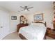 Cozy bedroom with neutral tones, complemented by a ceiling fan and plenty of natural light at 1688 Town Park Dr, Port Orange, FL 32129