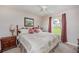 Comfortable bedroom featuring a ceiling fan, natural light, and a serene view of the outdoors at 1688 Town Park Dr, Port Orange, FL 32129