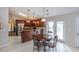 Modern kitchen offers stainless steel appliances, granite countertops, and a breakfast bar with rich wood cabinetry at 1688 Town Park Dr, Port Orange, FL 32129