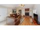 Spacious living room with a brick fireplace, hardwood floors and large sofas at 1688 Town Park Dr, Port Orange, FL 32129