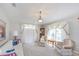 Well-lit formal living room provides neutral tones and traditional finishes with comfortable seating at 1688 Town Park Dr, Port Orange, FL 32129