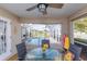 Cozy covered patio with views of the pool and lake at 1688 Town Park Dr, Port Orange, FL 32129
