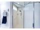 Modern shower equipped with safety features, tiled walls, and a convenient handheld shower head at 1688 Town Park Dr, Port Orange, FL 32129