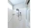Clean white shower with safety bar and dual shower heads at 1688 Town Park Dr, Port Orange, FL 32129
