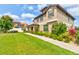 Well-maintained home exterior with lush landscaping and a beautiful lawn and walkway at 1703 Frogs Leap Ct, Port Orange, FL 32128