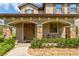 Inviting front porch with stone accents, offering a cozy outdoor seating area at 1703 Frogs Leap Ct, Port Orange, FL 32128