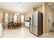 Bright dining area showcasing tile floors, and large windows at 1748 Savannah Ln, Port Orange, FL 32128
