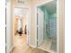 Hallway view revealing a bathroom and a bedroom showcasing the home's layout at 1748 Savannah Ln, Port Orange, FL 32128