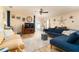 Comfortable living room featuring a ceiling fan, plush seating, and neutral decor at 1748 Savannah Ln, Port Orange, FL 32128