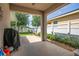 View of the covered outdoor patio and backyard, complete with a grill at 1748 Savannah Ln, Port Orange, FL 32128