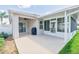 Spacious back patio with covered and screened areas for year-round enjoyment at 1748 Savannah Ln, Port Orange, FL 32128