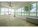 Bright, spacious sunroom with multiple windows offering picturesque views of the yard at 1748 Savannah Ln, Port Orange, FL 32128