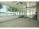 Bright sunroom featuring scenic views from numerous windows, enhancing its spacious feel at 1748 Savannah Ln, Port Orange, FL 32128