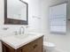 Bathroom features a stylish vanity and a large mirror at 1812 Bayview Dr, New Smyrna Beach, FL 32168
