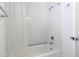 Bathroom features a white shower and tub with a shower curtain at 1812 Bayview Dr, New Smyrna Beach, FL 32168