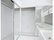 This bathroom features a large soaking tub with marble surround, tile floor, and mirrored closet at 1812 Bayview Dr, New Smyrna Beach, FL 32168